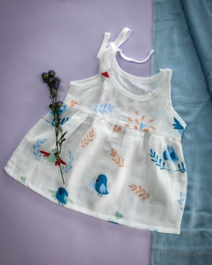 "Affordable Baby Muslin Dress - Eco-Friendly Baby Clothing - Soft and Sustainable Babywear"